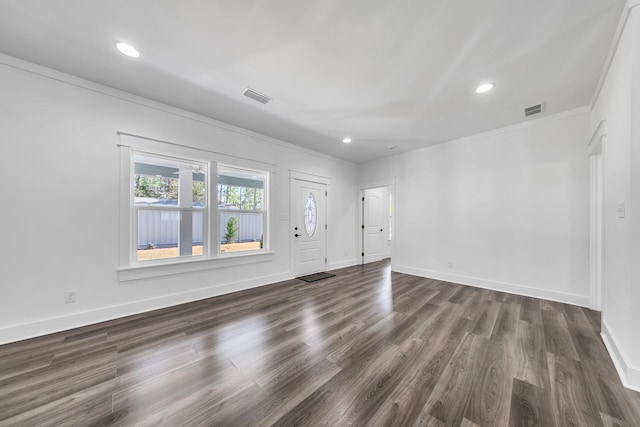 interior space featuring crown molding and dark hardwood / wood-style flooring