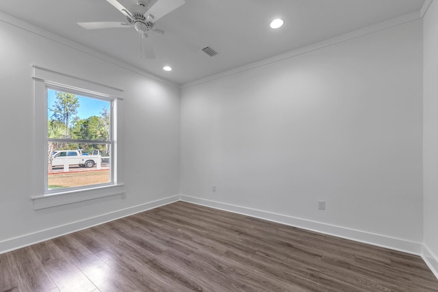 unfurnished room with crown molding, dark hardwood / wood-style floors, and ceiling fan