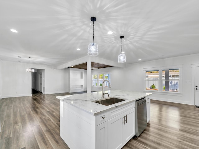 kitchen featuring pendant lighting, sink, white cabinetry, light stone countertops, and stainless steel dishwasher