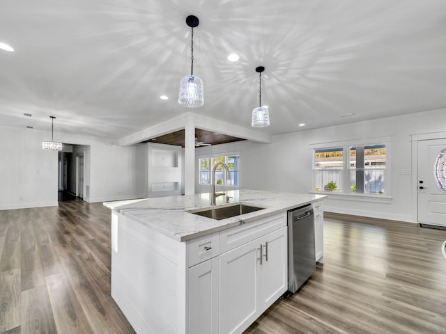 kitchen with pendant lighting, dishwasher, sink, and white cabinets