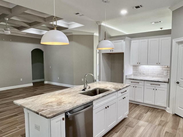 kitchen with sink, dishwasher, hanging light fixtures, coffered ceiling, and white cabinets