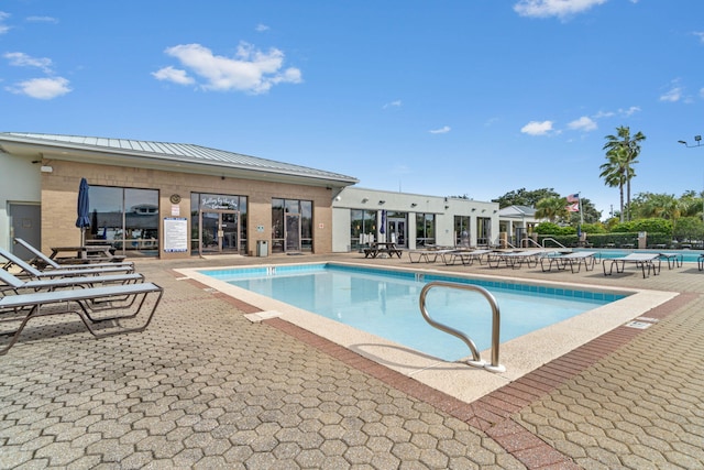 view of swimming pool with a patio