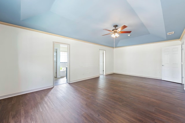 unfurnished room featuring dark hardwood / wood-style floors, vaulted ceiling, ceiling fan, and crown molding