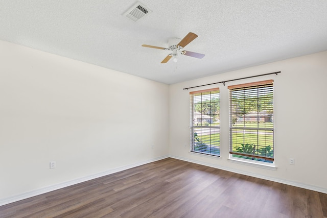 unfurnished room with a textured ceiling, hardwood / wood-style flooring, and ceiling fan