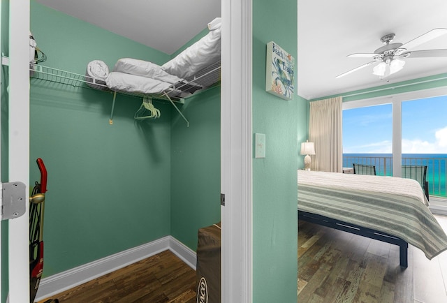 bedroom with ceiling fan and hardwood / wood-style flooring