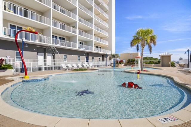 view of pool featuring pool water feature