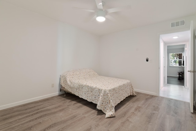 bedroom featuring wood-type flooring and ceiling fan