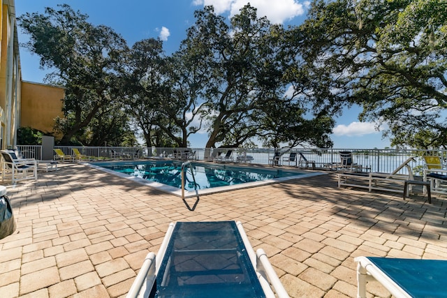 view of swimming pool with a patio