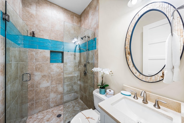 bathroom with vanity, toilet, and an enclosed shower