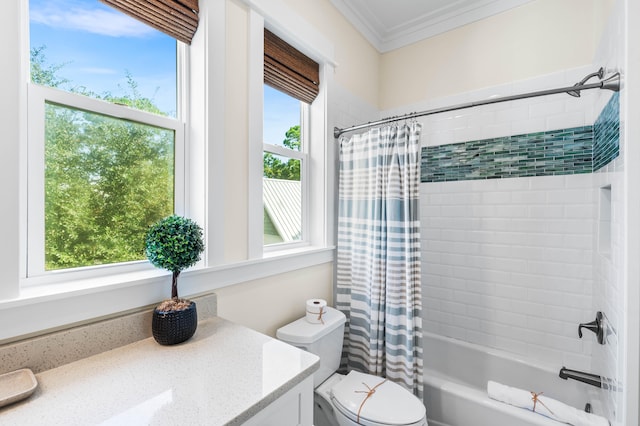 full bathroom featuring shower / tub combo with curtain, plenty of natural light, vanity, and toilet