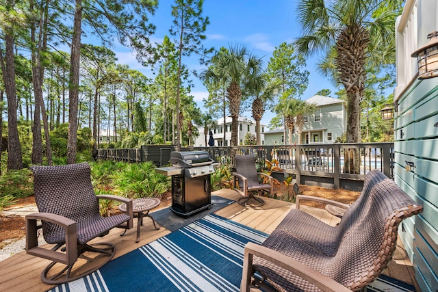 wooden terrace featuring area for grilling