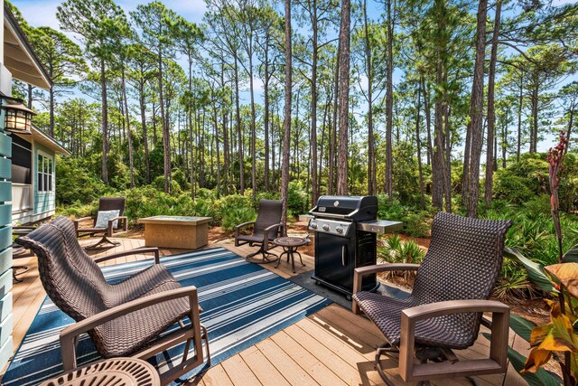 wooden terrace with area for grilling