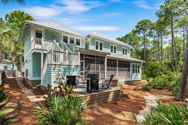 rear view of house with a sunroom