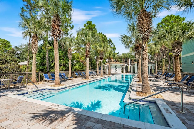 view of swimming pool with a patio area