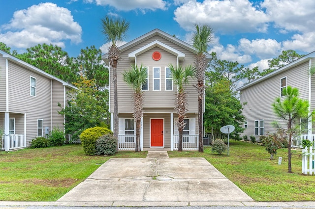 front of property featuring a porch and a front yard