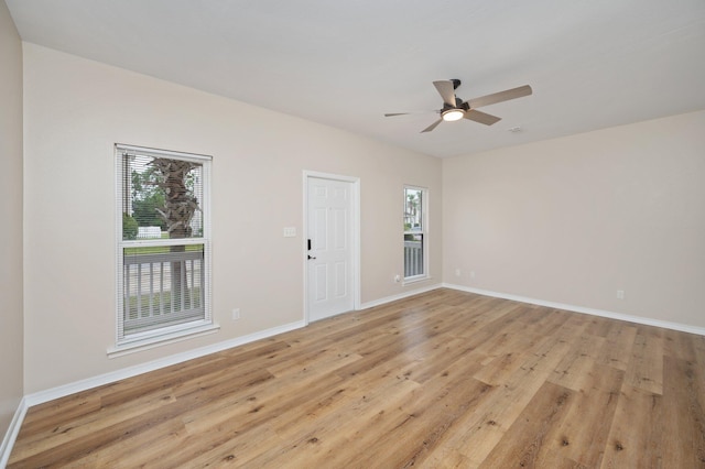 unfurnished room with light hardwood / wood-style flooring and ceiling fan