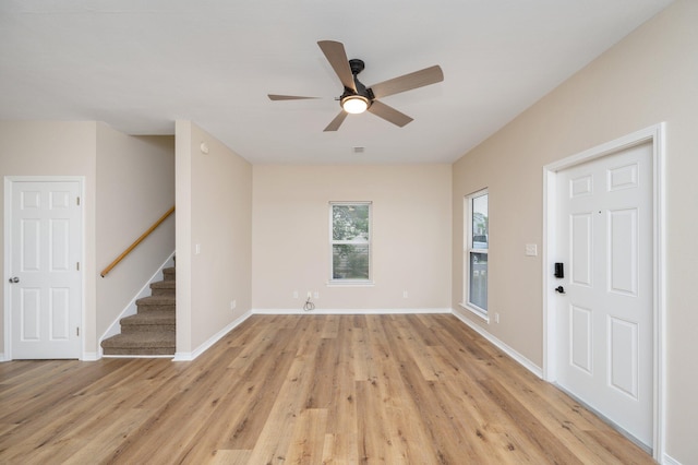 unfurnished room featuring ceiling fan and light hardwood / wood-style flooring