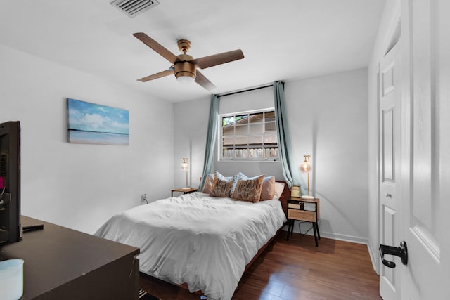 bedroom featuring a closet, ceiling fan, and dark hardwood / wood-style floors