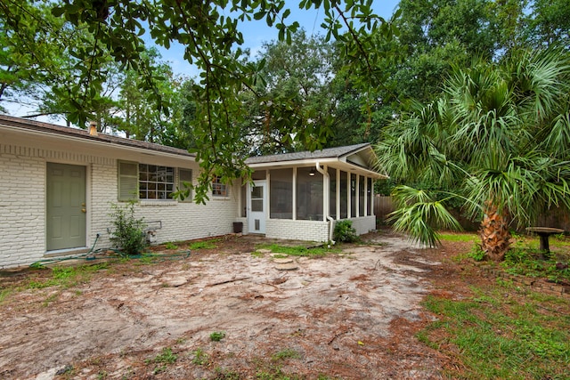 view of yard featuring a sunroom