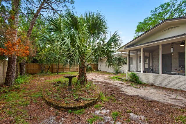 view of yard with ceiling fan