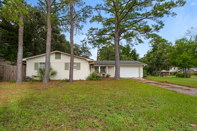 ranch-style home with a front yard and a garage