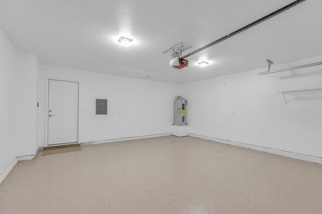 garage with a garage door opener, electric panel, and electric water heater