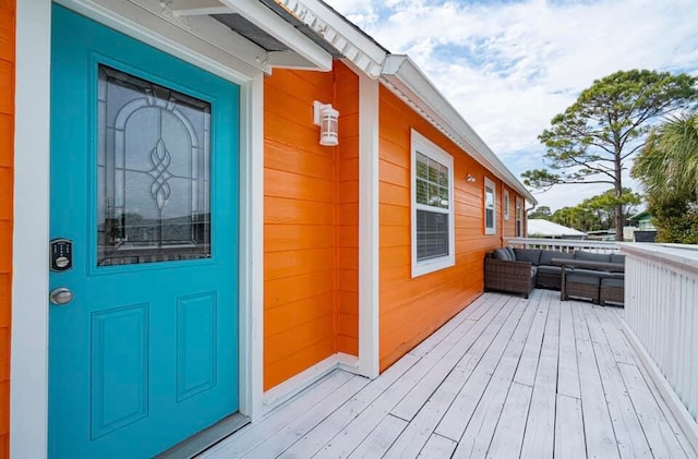 property entrance featuring a deck