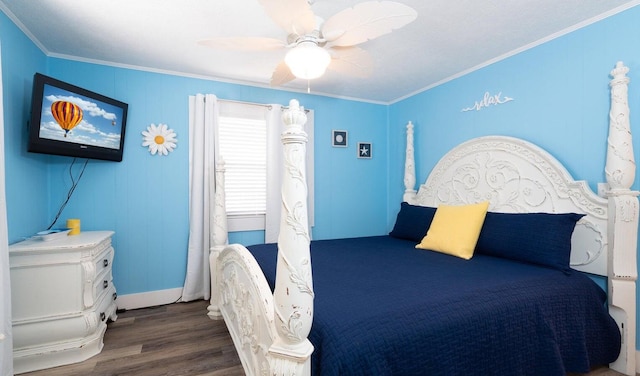 bedroom with dark wood-type flooring, ceiling fan, and ornamental molding