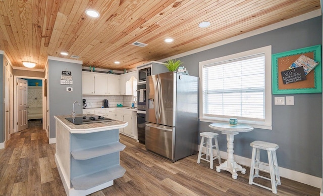 kitchen featuring wooden ceiling, black appliances, backsplash, white cabinetry, and light wood-type flooring