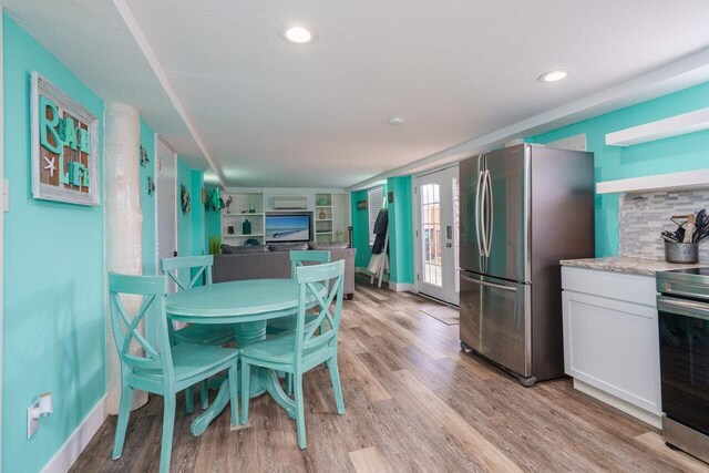 dining room featuring light wood-type flooring