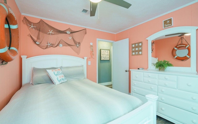 bedroom with ceiling fan and ornamental molding