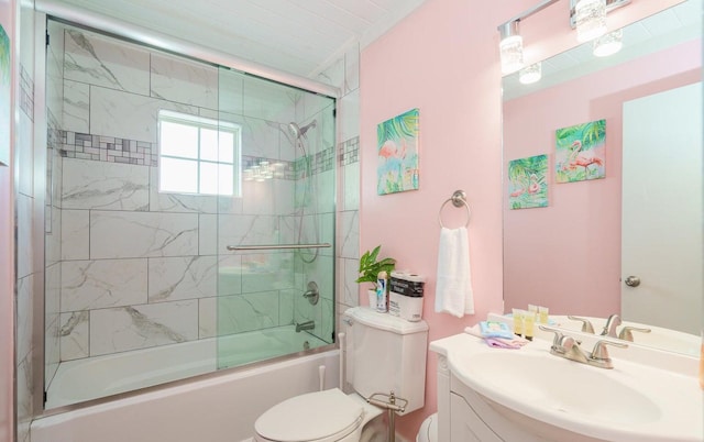 full bathroom with shower / bath combination with glass door, vanity, and toilet