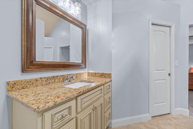 bathroom with tile patterned flooring and vanity