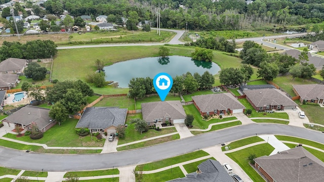 birds eye view of property with a residential view and a water view