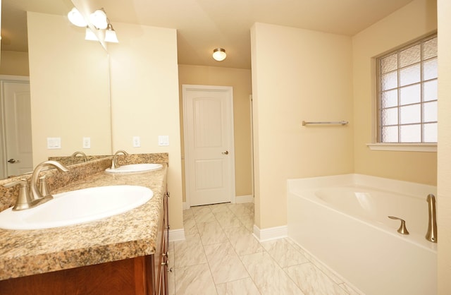 bathroom featuring a bathing tub and vanity