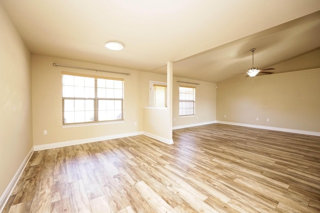 interior space featuring ceiling fan, light hardwood / wood-style flooring, and vaulted ceiling