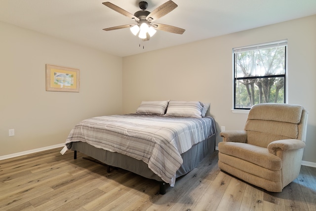 bedroom featuring ceiling fan and light hardwood / wood-style flooring