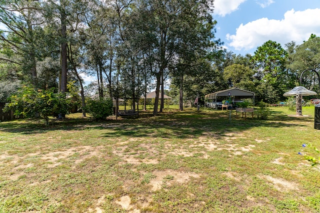 view of yard with a carport