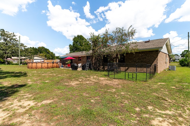 view of yard featuring a patio area and central AC unit