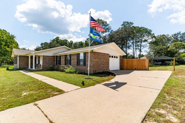 view of front of house with a garage and a front lawn