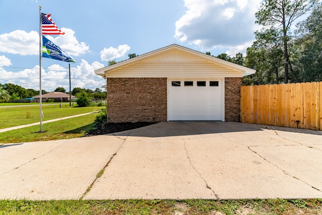 garage featuring a lawn