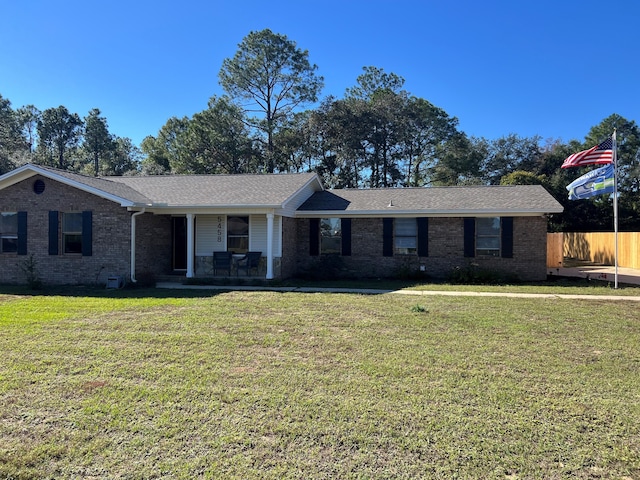 single story home featuring a front yard