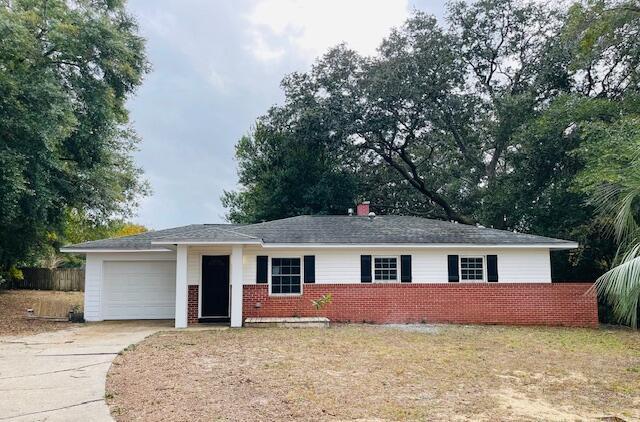 ranch-style house featuring a garage