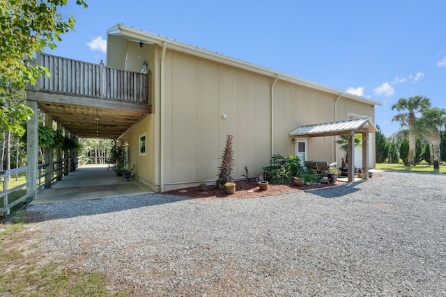 view of home's exterior with a carport