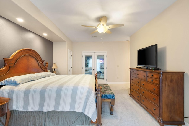 carpeted bedroom with ceiling fan and french doors