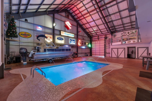 view of swimming pool with pool water feature