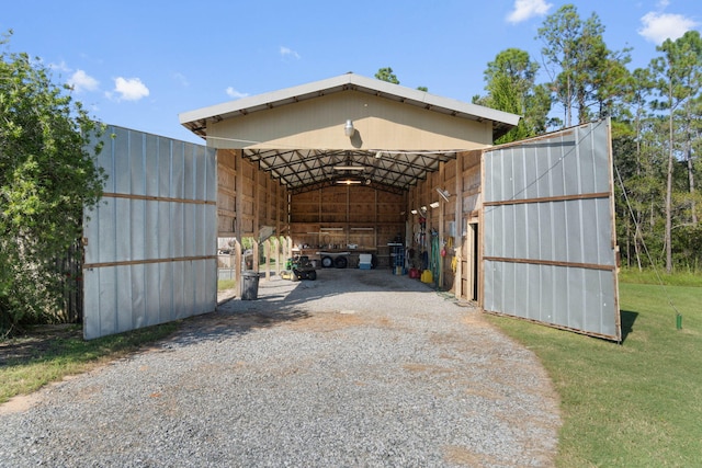 view of parking featuring a carport and a yard