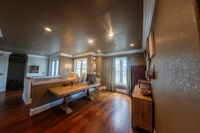 kitchen with pendant lighting, a textured ceiling, dark wood-type flooring, an inviting chandelier, and ornamental molding