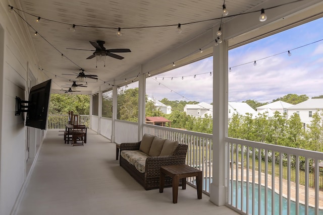 view of patio / terrace with a fenced in pool and ceiling fan