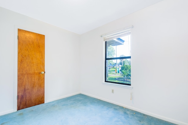 empty room with carpet flooring